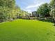 Community dog park featuring mature landscaping and fencing at 402 River Vista Dr, Atlanta, GA 30339