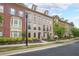 Charming townhome exterior featuring well-maintained landscaping and inviting curb appeal at 402 River Vista Dr, Atlanta, GA 30339