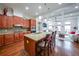 Open-concept kitchen featuring granite countertops, stainless steel appliances and a breakfast bar at 402 River Vista Dr, Atlanta, GA 30339