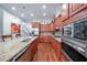 Modern kitchen boasts stainless steel appliances, granite countertops, and dark wood cabinets at 402 River Vista Dr, Atlanta, GA 30339