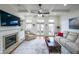Inviting living room featuring a fireplace, built-in shelving and plenty of natural light at 402 River Vista Dr, Atlanta, GA 30339