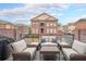 A comfortable outdoor patio features wicker furniture and overlooks the neighborhood at 402 River Vista Dr, Atlanta, GA 30339