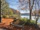 A picturesque river view from the property with a bench and lush foliage at 402 River Vista Dr, Atlanta, GA 30339