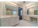 Bathroom with double sink vanity, large mirrors and tile flooring at 1170 Livery Cir, Lawrenceville, GA 30046