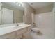 Bright bathroom with a single sink vanity, white cabinets, and a shower-tub combination at 1170 Livery Cir, Lawrenceville, GA 30046