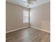 This bedroom has neutral walls, wood floor and a window with blinds at 1170 Livery Cir, Lawrenceville, GA 30046