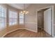 Cozy dining area with natural light and classic chandelier, perfect for Gathering meals at 1170 Livery Cir, Lawrenceville, GA 30046