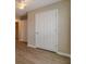 Hallway showcasing wood floors, neutral walls, and doors to other rooms at 1170 Livery Cir, Lawrenceville, GA 30046
