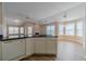 Open concept kitchen featuring wood floors and a breakfast bar island at 1170 Livery Cir, Lawrenceville, GA 30046