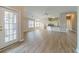 Open floor plan with hardwood floors flows from the living room to the kitchen with bar top at 1170 Livery Cir, Lawrenceville, GA 30046