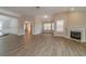 Bright and spacious living room showcasing wood floors, vaulted ceilings, and a fireplace at 1170 Livery Cir, Lawrenceville, GA 30046