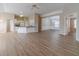 Open-concept living area with wood floors, connecting the kitchen, living room, and dining area at 1170 Livery Cir, Lawrenceville, GA 30046
