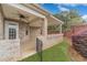 Cozy covered patio with brick columns, a ceiling fan and access to the backyard at 1170 Livery Cir, Lawrenceville, GA 30046
