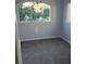 Small bedroom featuring natural light and gray carpet at 136 Rue Fontaine, Lithonia, GA 30038