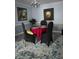 Cozy dining room with contemporary furnishings, paintings, and carpet at 136 Rue Fontaine, Lithonia, GA 30038