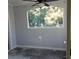 Sunroom features a ceiling fan and a large window overlooking the backyard at 136 Rue Fontaine, Lithonia, GA 30038