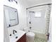 Stylish bathroom featuring modern fixtures, decorative tiles, and a shower-tub combination for a relaxing experience at 1735 Spring Ave, East Point, GA 30344