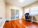 Functional bedroom with hardwood floors, closet, and a dedicated workspace, ideal for both rest and productivity at 1735 Spring Ave, East Point, GA 30344