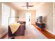 Bright living room with hardwood floors, stylish rug, and a view into the kitchen, perfect for modern living at 1735 Spring Ave, East Point, GA 30344