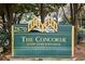 Community sign that reads: The Concorde Luxury Living in Buckhead, set among mature trees and landscaping at 2870 Pharr Court South Nw # 1209, Atlanta, GA 30305