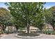 Serene park-like setting with mature trees, benches, and manicured landscaping for relaxation and enjoyment at 2870 Pharr Court South Nw # 1209, Atlanta, GA 30305