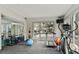 Home gym with a treadmill, elliptical, weight rack, and mirrors, offering a complete fitness setup at 2870 Pharr Court South Nw # 1209, Atlanta, GA 30305