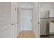 Hallway view with tile floors, closet and stainless steel refrigerator at 2870 Pharr Court South Nw # 1209, Atlanta, GA 30305