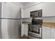 Modern kitchen with stainless steel appliances and sleek countertops at 2870 Pharr Court South Nw # 1209, Atlanta, GA 30305