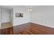 Bright living room with beautiful hardwood floors and an opening into the kitchen at 2870 Pharr Court South Nw # 1209, Atlanta, GA 30305