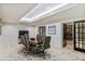 Office space with marble floors, sliding door, a wooden table, and rolling office chairs at 2870 Pharr Court South Nw # 1209, Atlanta, GA 30305