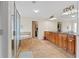 A luxurious bathroom featuring a glass shower, large tub, and a dual vanity at 426 Vera Park Pl, Alpharetta, GA 30022