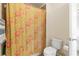 Bathroom with a shower featuring a floral curtain and toilet at 426 Vera Park Pl, Alpharetta, GA 30022