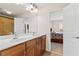 Bathroom with a dual vanity and mirrors, with access to the bedroom at 426 Vera Park Pl, Alpharetta, GA 30022