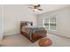 Cozy bedroom with natural light, ceiling fan, and a fun football-themed rug at 426 Vera Park Pl, Alpharetta, GA 30022