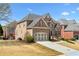 Spacious brick home with a well-kept lawn, a two-car garage, and traditional architectural details at 426 Vera Park Pl, Alpharetta, GA 30022