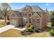 Beautiful brick home with manicured landscaping, a spacious driveway, and a two-car garage at 426 Vera Park Pl, Alpharetta, GA 30022
