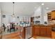 Kitchen island with stainless steel appliances and view of the living room and fireplace at 426 Vera Park Pl, Alpharetta, GA 30022