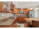 Kitchen features stainless steel appliances, granite countertops, and wood cabinets at 426 Vera Park Pl, Alpharetta, GA 30022