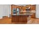 Kitchen featuring a large island, stainless steel appliances, and wooden cabinetry at 426 Vera Park Pl, Alpharetta, GA 30022