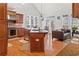 Open kitchen with a large island, stainless steel appliances, and access to the backyard at 426 Vera Park Pl, Alpharetta, GA 30022