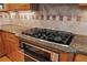 Gourmet kitchen featuring granite countertops and stainless steel cooktop at 426 Vera Park Pl, Alpharetta, GA 30022