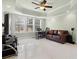 Comfortable living room with abundant natural light and ceiling fan at 426 Vera Park Pl, Alpharetta, GA 30022