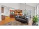 Open-concept living room, dining, and kitchen area features hardwood floors and lots of natural light at 426 Vera Park Pl, Alpharetta, GA 30022