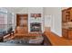 Bright living room featuring a stone fireplace, built-in shelving, and hardwood floors at 426 Vera Park Pl, Alpharetta, GA 30022