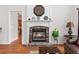 Cozy living room features a stone fireplace, hardwood floors, and ample space for Gathering gatherings at 426 Vera Park Pl, Alpharetta, GA 30022