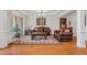 Cozy living room with hardwood floors, chandelier, and a traditional rug, great for entertaining or relaxing at 426 Vera Park Pl, Alpharetta, GA 30022