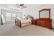 Spacious main bedroom with plush carpet, neutral walls, and large windows for plenty of light at 426 Vera Park Pl, Alpharetta, GA 30022