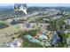 Aerial shot of the community's amenities, including a pool, tennis courts, clubhouse, and a golf course at 432 Horizon Trl, Canton, GA 30114