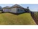 Large backyard with well-maintained lawn, partial fence, and a view of the home's exterior at 432 Horizon Trl, Canton, GA 30114