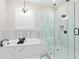 Elegant bathroom with marble tile, soaking tub, glass shower, and modern fixtures at 432 Horizon Trl, Canton, GA 30114